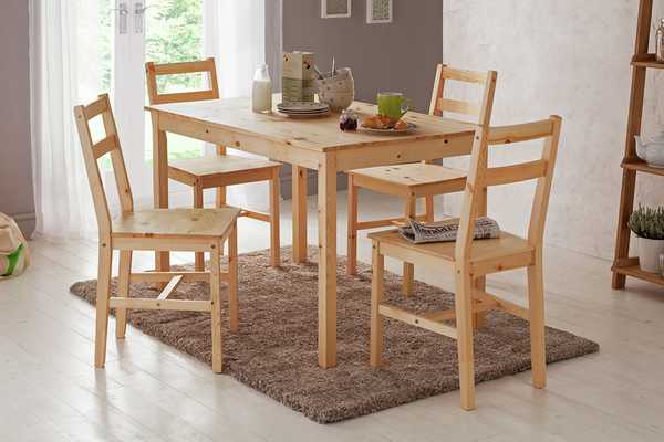 Argos Home Raye Solid Wood 4 Seater Dining Table in a living room.